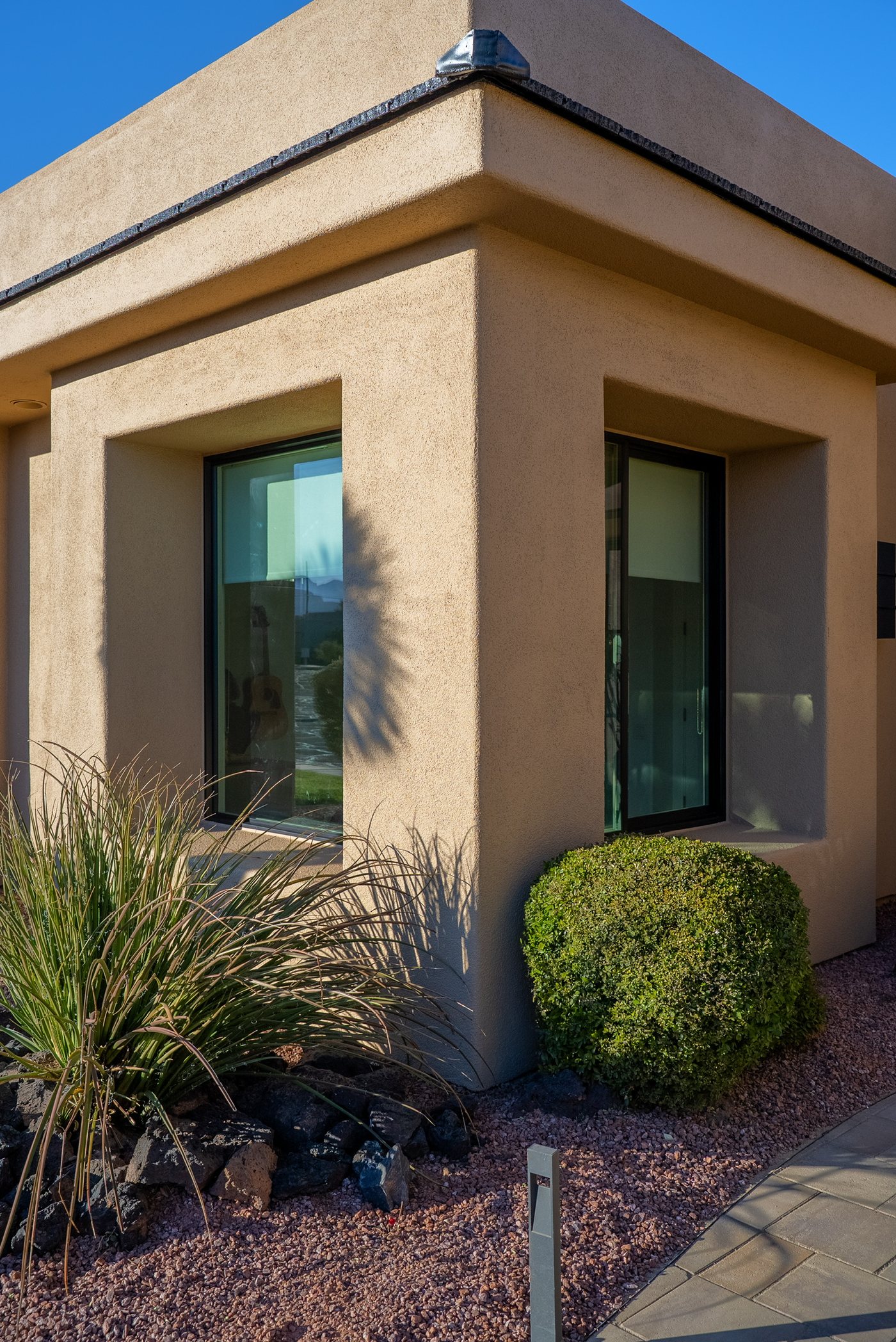 Completed JKR windows on a landscaped desert home